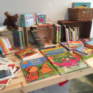Display of children's books at a book sale event.