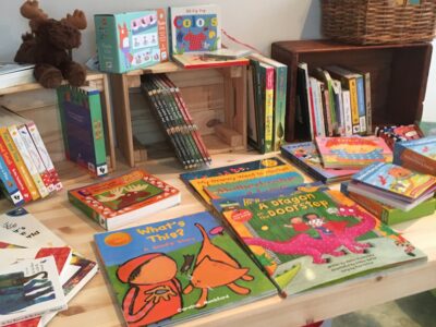 Display of children's books at a book sale event.